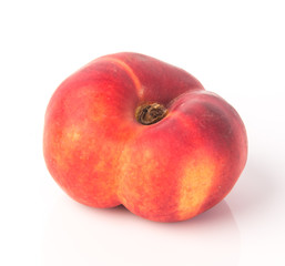 flat peaches (donut peaches) on a background