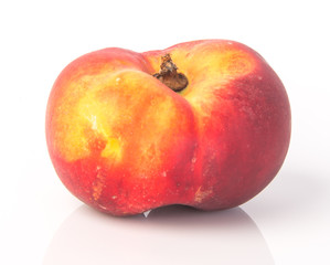 flat peaches (donut peaches) on a background