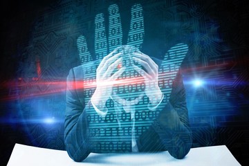 Composite image of businessman with head in hands