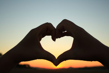 Fototapeta premium hands forming a heart