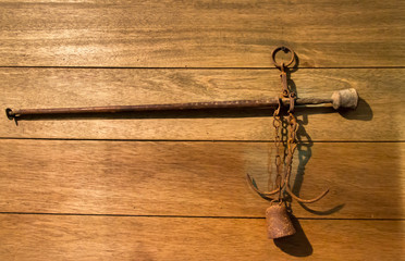 Antique asian steelyard scales   hanging on wooden wall