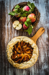 Apple pie on rustic wooden background