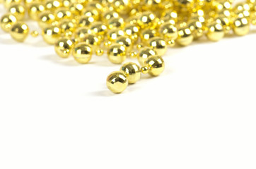 Background made of a brilliant celebratory beads of golden color