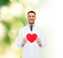 smiling male doctor with red heart