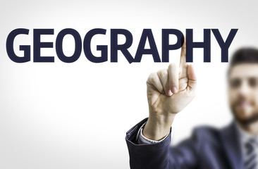 Business man pointing to transparent board with text: Geography