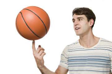 basket ball on finger of man