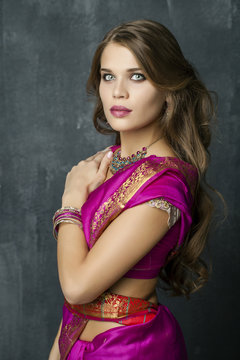Young pretty woman in indian red dress
