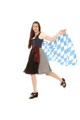 Junges Mädchen in Bayrischer Tracht und bayrischen Fahnen