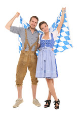Bayrisches Paar in Tracht mit Rautenflagge