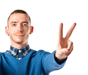 Man making Ok sign over white background