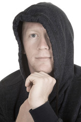 man with hoodie over part of face hand on chin