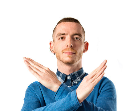 Man doing NO gesture over white background
