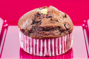 Closeup of a muffin on a red plate