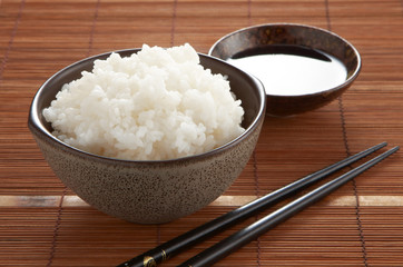 japanese rice in cup on wooden tray