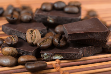 chocolate and coffee beans on brown bamboo  background