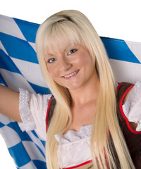 hübsche Frau im Dirndl mit Bayern Flagge