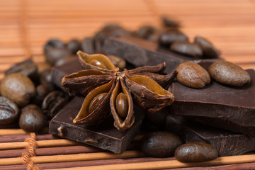 Close up of  anise with chocolate and coffee heap