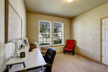 Simple office room with white desk