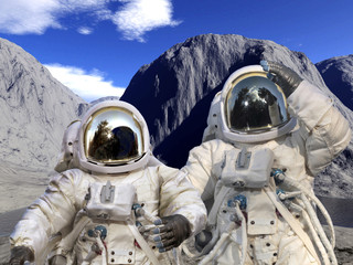 Astronauts on a rocky landscape