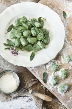 homemade spinach dumplings with sage and flower