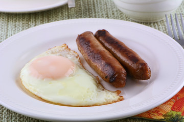 Fried egg and sausage links