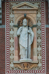 Statue of a prist in Courtyard of Castello Sforzesco, Milan, Ita