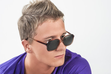 Young Caucasian Man in Eyeglasses Staring Away