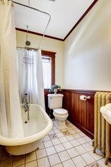 Bathroom with bath tub white wraparound curtain