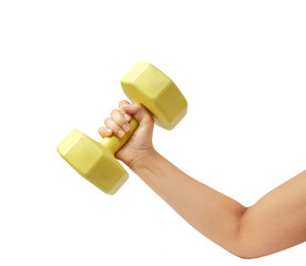 Female hand holding yellow plastic coated dumbell isolated on wh