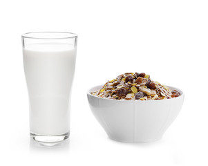 milk in the glass and pile of muesli on white background