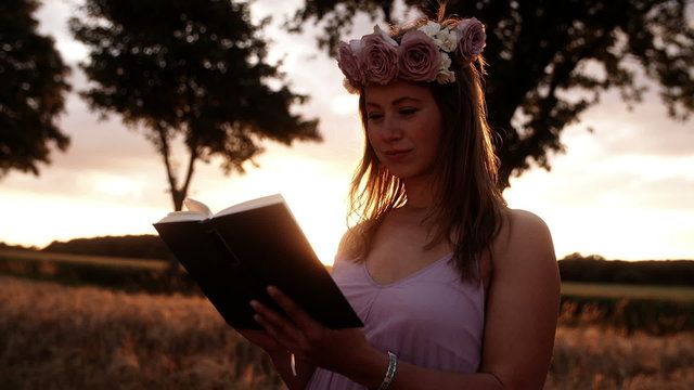 Girl Reading At Sunset