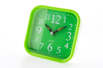 Green clock isolated on white background