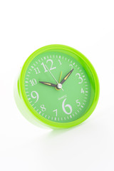 Green clock isolated on white background