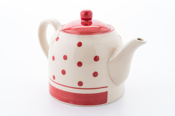 Polka dot tea pot isolated on white background