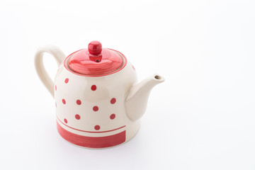 Polka dot tea pot isolated on white background