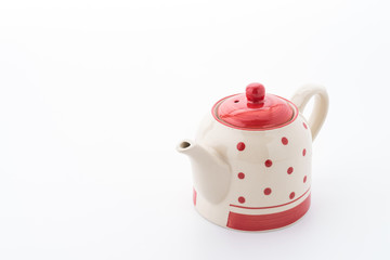 Polka dot tea pot isolated on white background