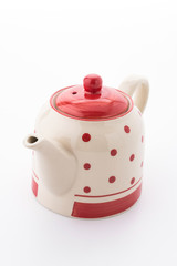 Polka dot tea pot isolated on white background