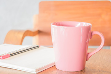 Freelance work table with notepaper and coffee