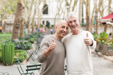 Gay Couple showing Thumbs Up in New York