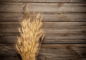 Wheat on wooden with copy space.
