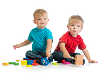 Happy children playing by mallet or hammer