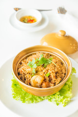 fried rice with shrimp and sausage in clay pot