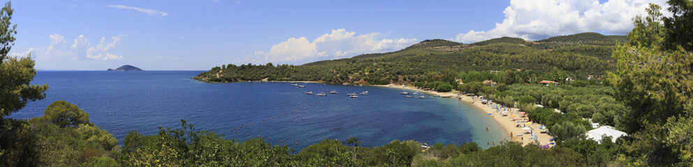 Panorama of beautiful bay of Aegean Sea with sandy beach.