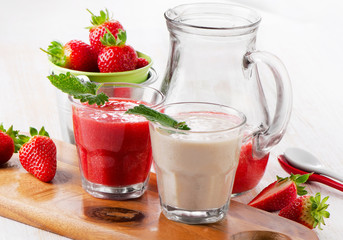 Strawberry smoothie on wooden background