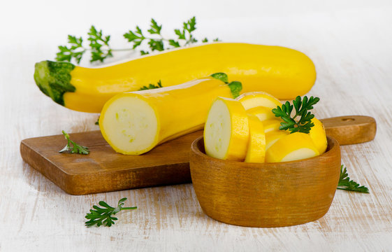 Yellow ripe zucchini on a  wooden table