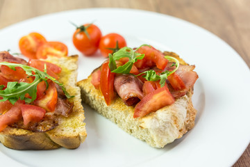 Italian Bruschetta Sandwich With Bacon, Rucola And Tomatoes