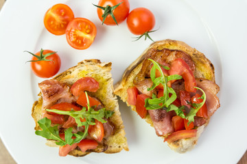 Italian Bruschetta Sandwich With Bacon, Rucola And Tomatoes