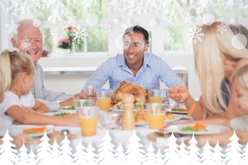 Composite image of happy family at thanksgiving