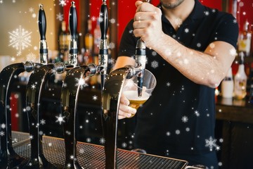 Composite image of barkeeper pulling a pint of beer
