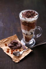 Yogurt, with chocolate cream, chopped chocolate and muesli